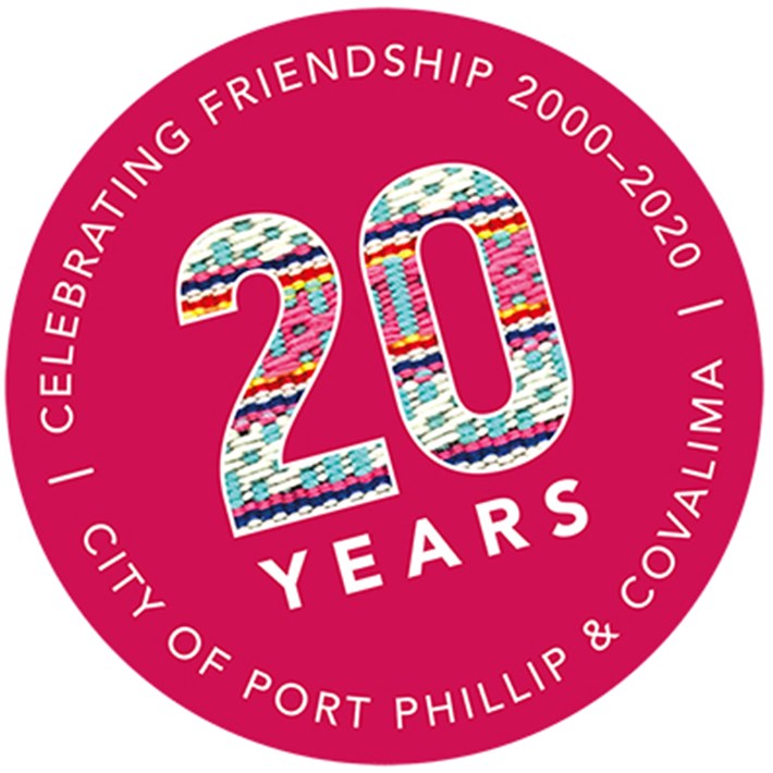 Friends of Suai 20-year pink circular logo with text reading: 20 years Celebrating Friendship 2000-2020, City of Port Phillip and Covalima