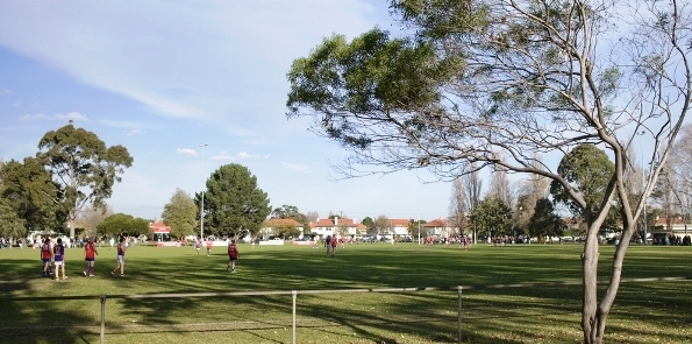 Local aussie rules game being played on JL Murphy Reserve
