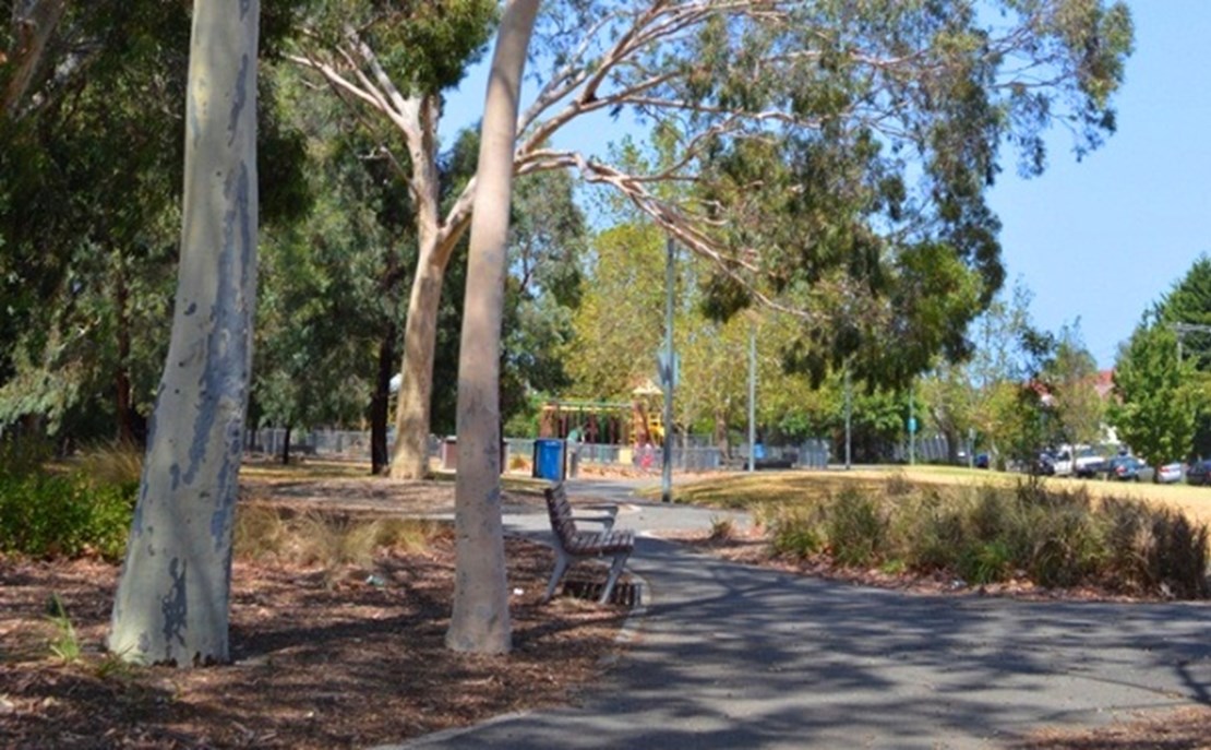 Hewison Reserve is accessible by paved paths and has seating, a playground, mature trees and grassy areas