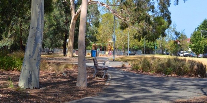 Hewison Reserve is accessible by paved paths and has seating, a playground, mature trees and grassy areas