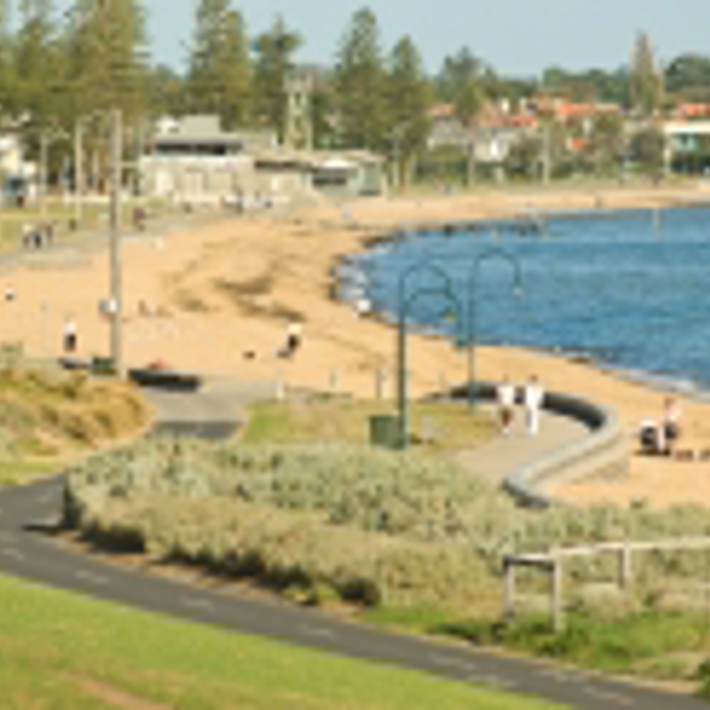 Bike path and footpath curving around Elwood beach and Bay looking towards the Elwood Life Saving Club