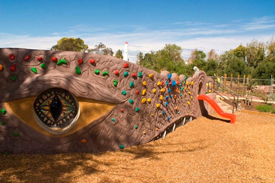 Playground facilities for use at Garden City Reserve designed around a dragons head