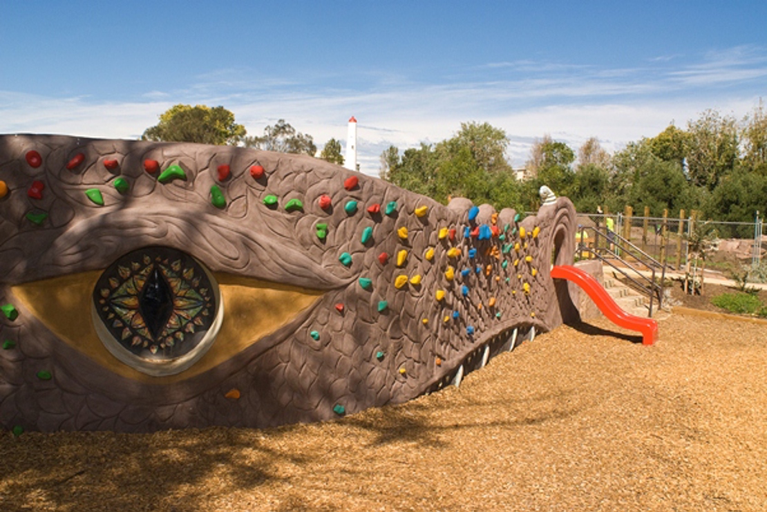 Playground facilities for use at Garden City Reserve designed around a dragons head