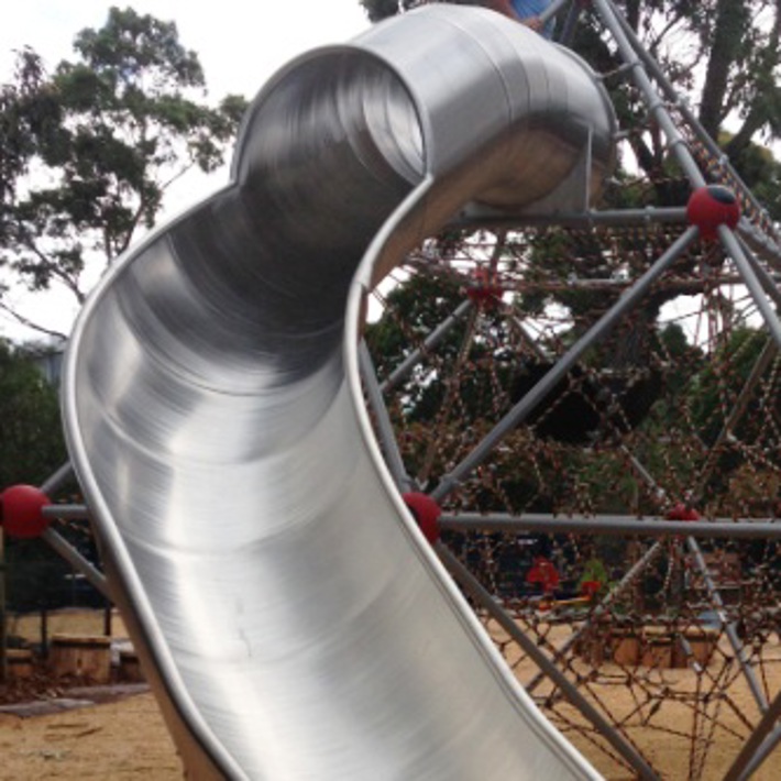 The playground includes a large slide
