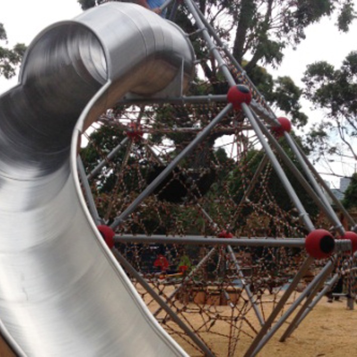 The playground includes a large slide