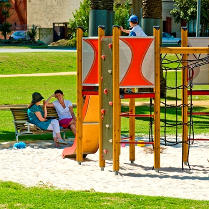 Playground facilities and bench seating available for use in Catani Gardens