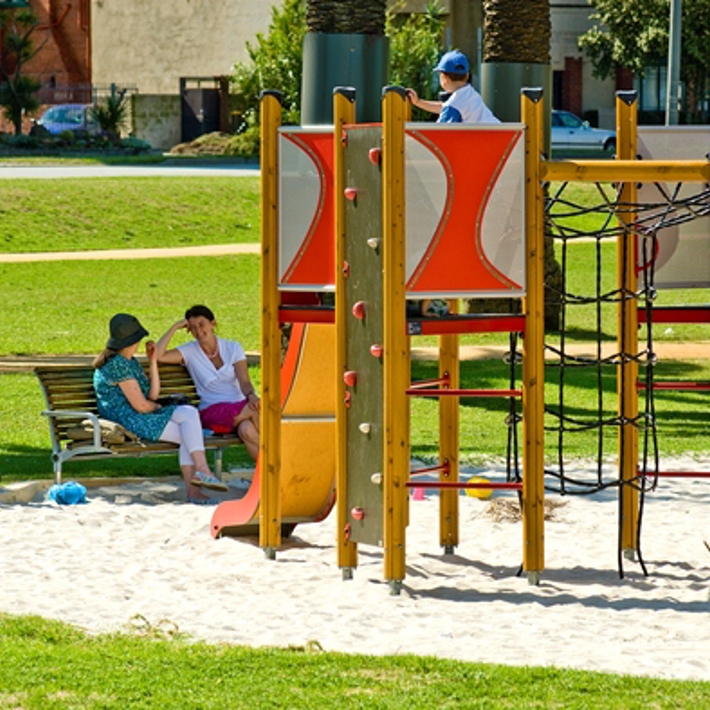 Playground facilities and bench seating available for use in Catani Gardens