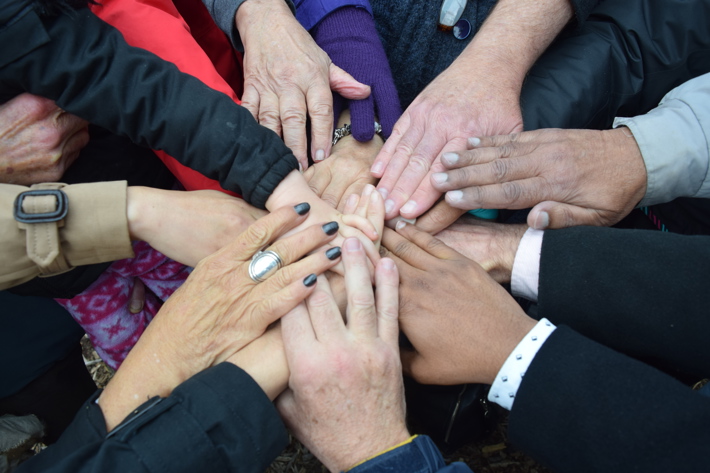 Hands stacked on top of each other 