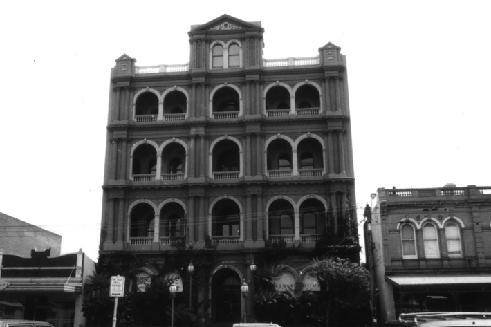 street view looking up at the Biltmore facade 4 stories with arched windows